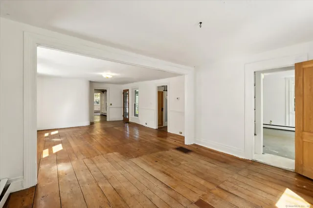 a view of a livingroom with wooden floor
