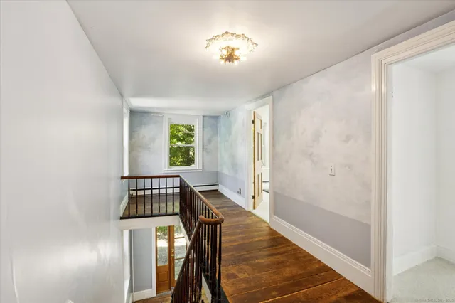 a view of entryway with wooden floor
