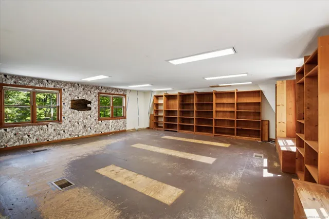 a view of a livingroom with furniture and window