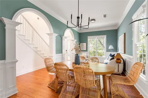 a view of a dining room with furniture window and wooden floor