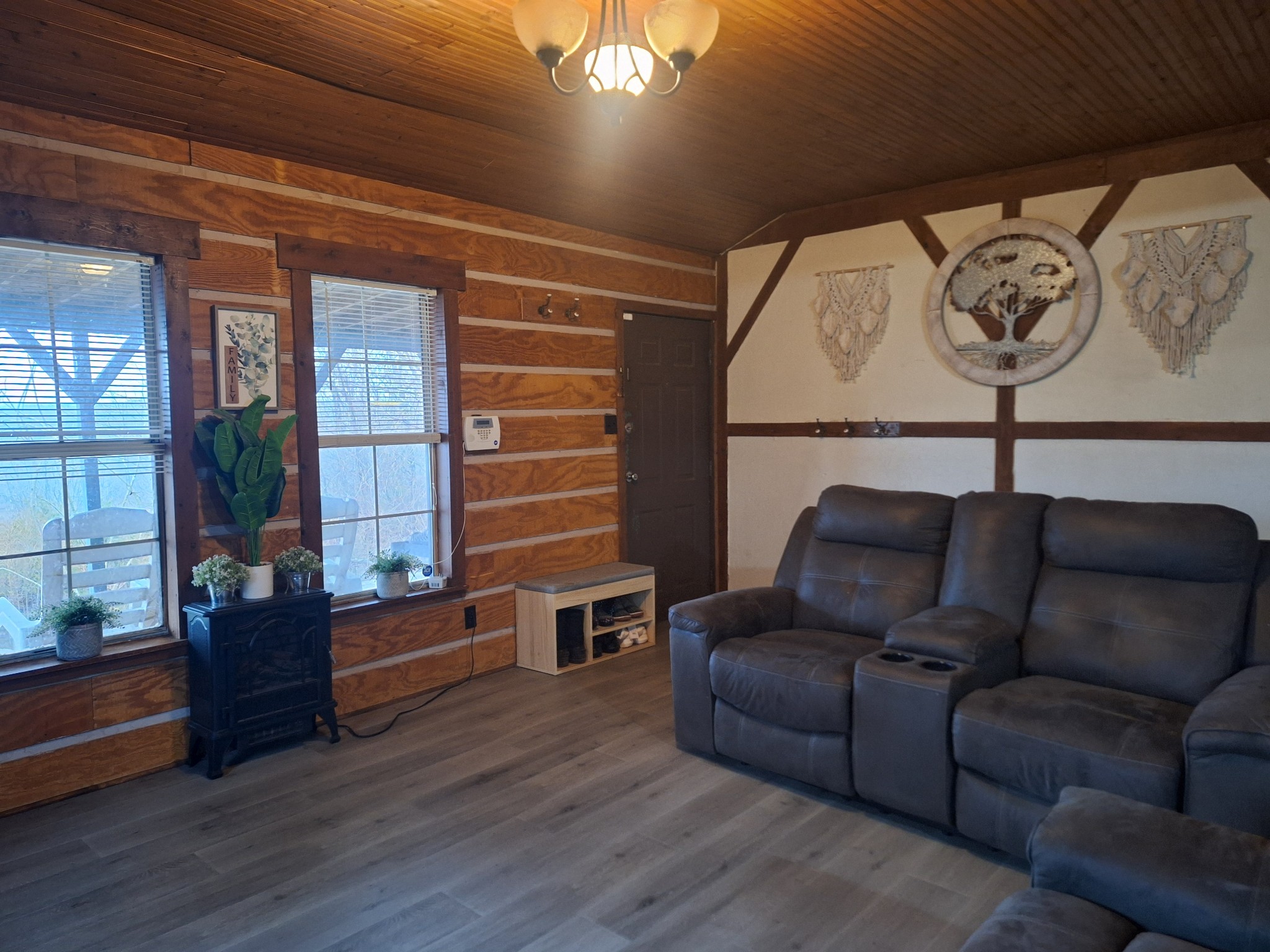 a couch sitting in a living room next to a window