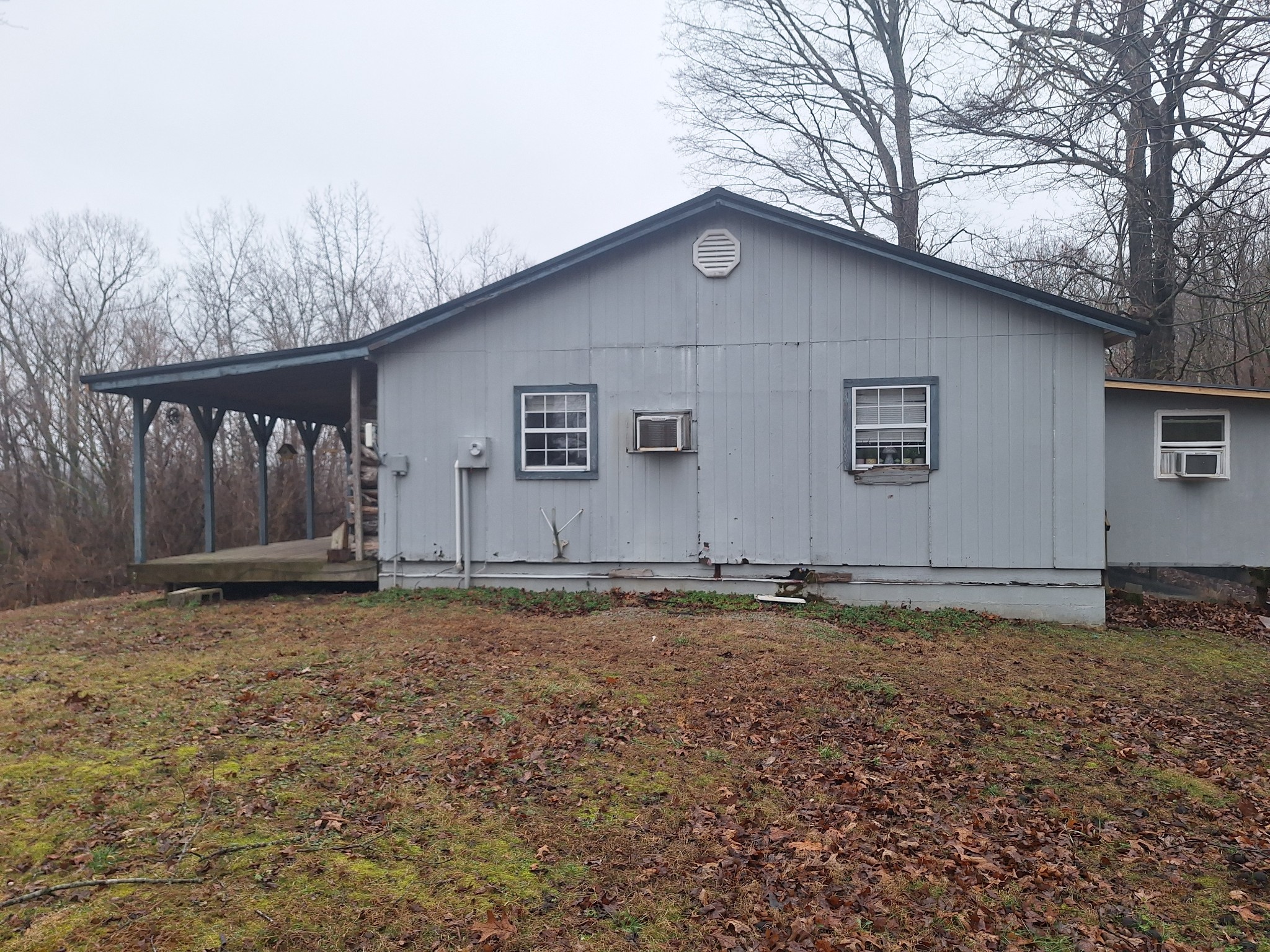 199 Dixon Ln. Waynesboro, TN 38485 - Photo 31 of 52 a house with trees in the background