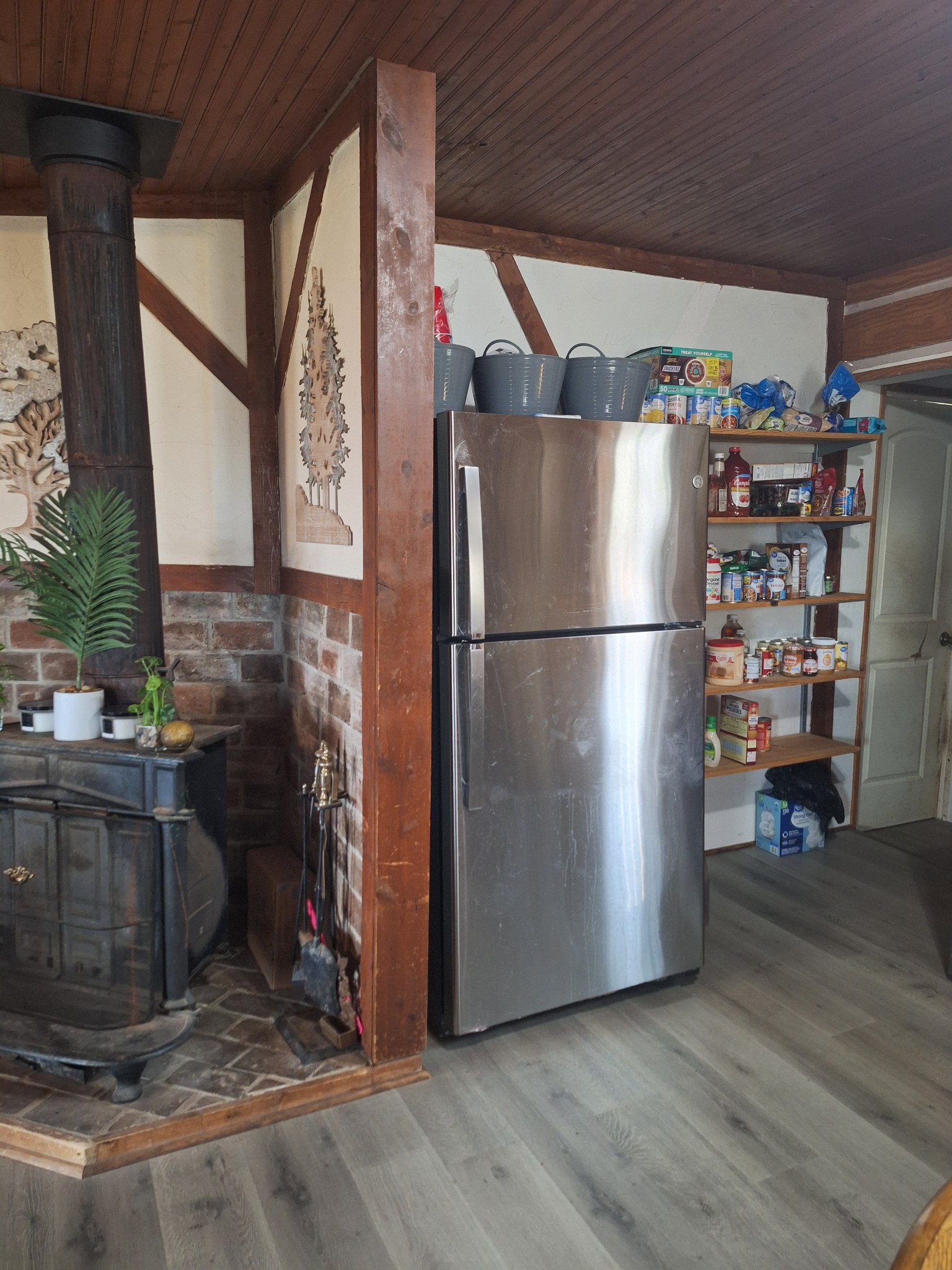 199 Dixon Ln. Waynesboro, TN 38485 - Photo 5 of 52 a kitchen with refrigerator and a wooden floor