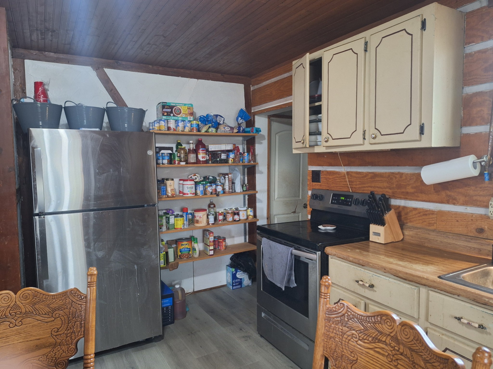 199 Dixon Ln. Waynesboro, TN 38485 - Photo 6 of 52 a kitchen with stainless steel appliances granite countertop a refrigerator and a stove
