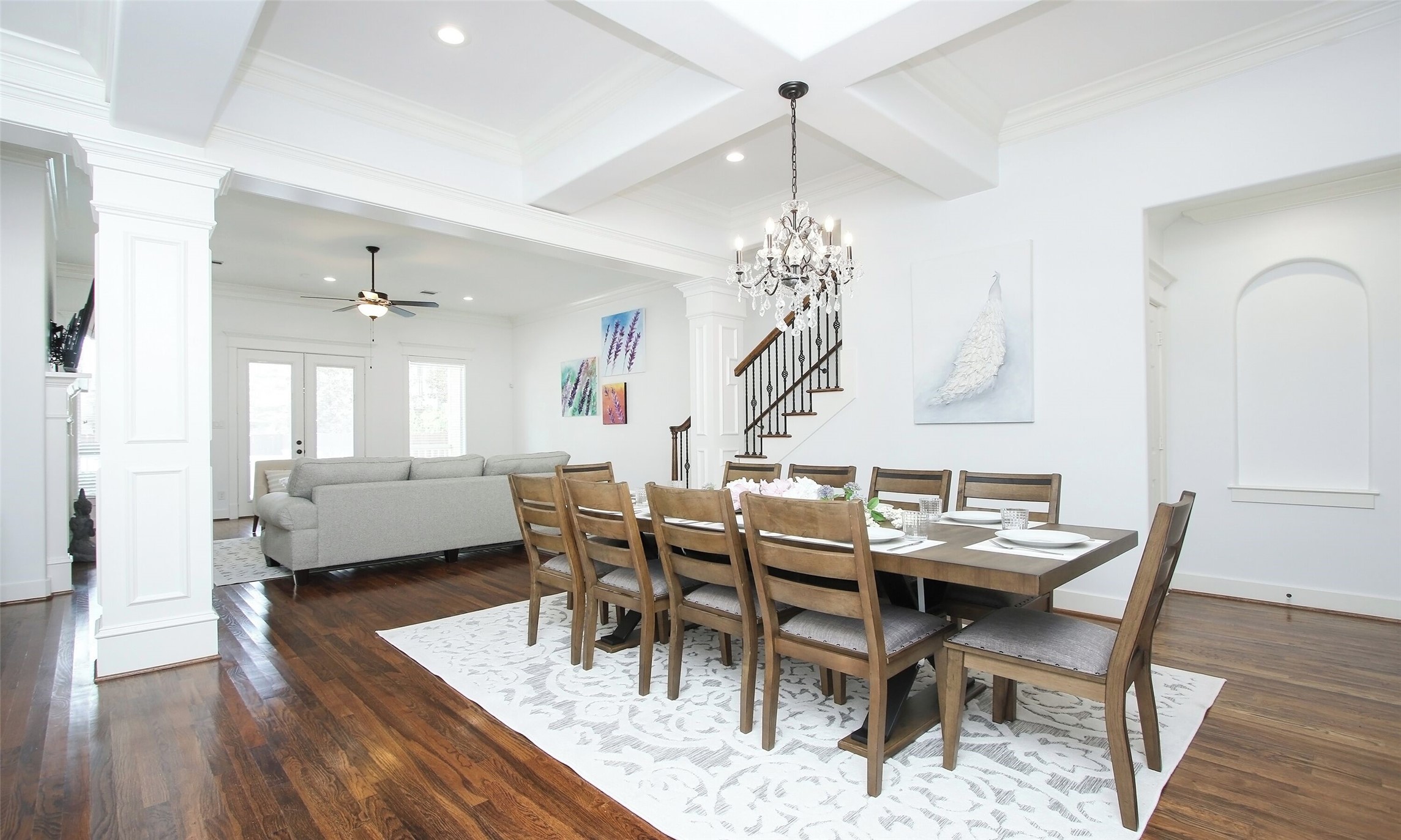 1330 West 25th Street, Unit C Houston, TX 77008 - Photo 10 of 30 a view of a dining room with furniture wooden floor and chandelier