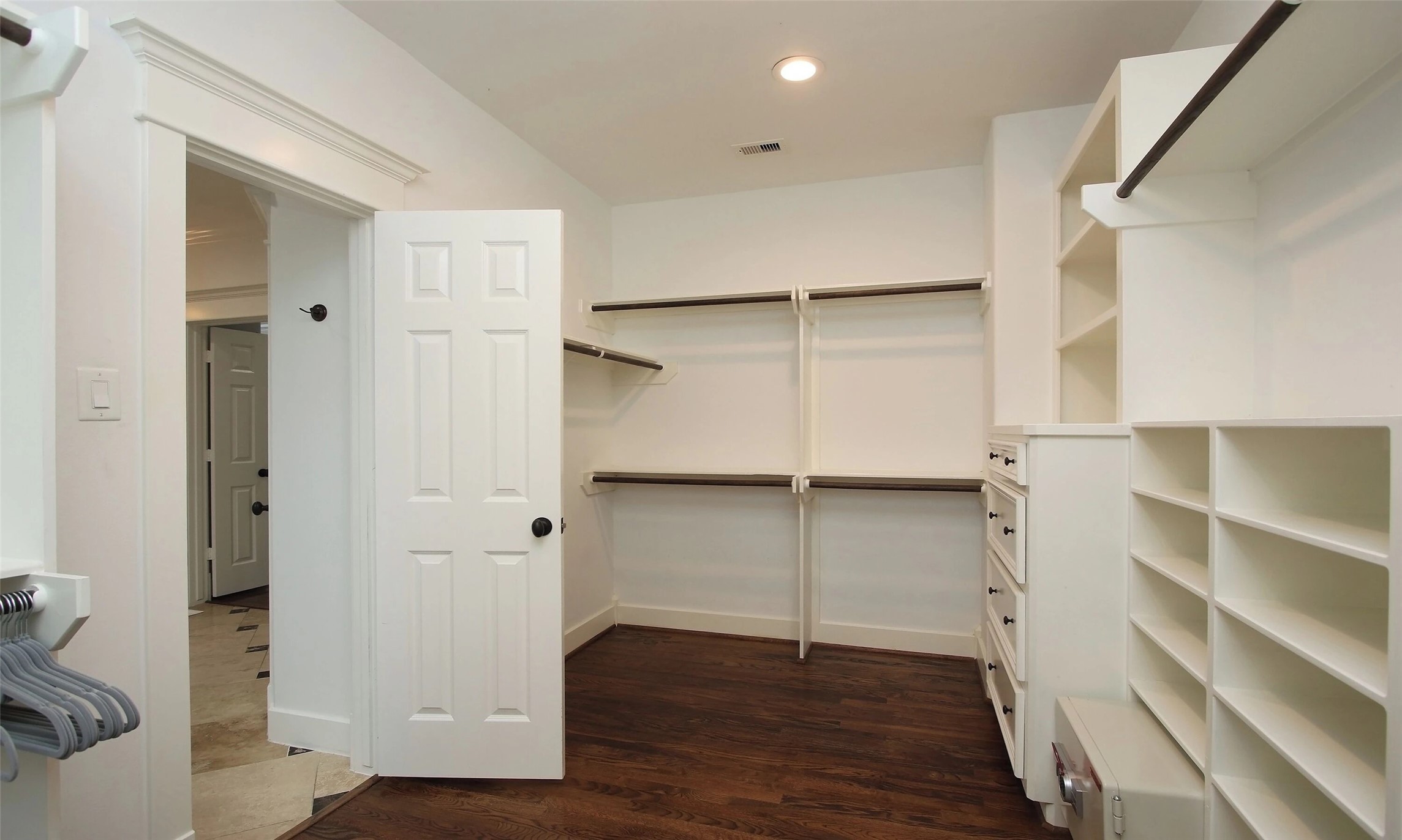 1330 West 25th Street, Unit C Houston, TX 77008 - Photo 18 of 30 a view of walk in closet with empty racks