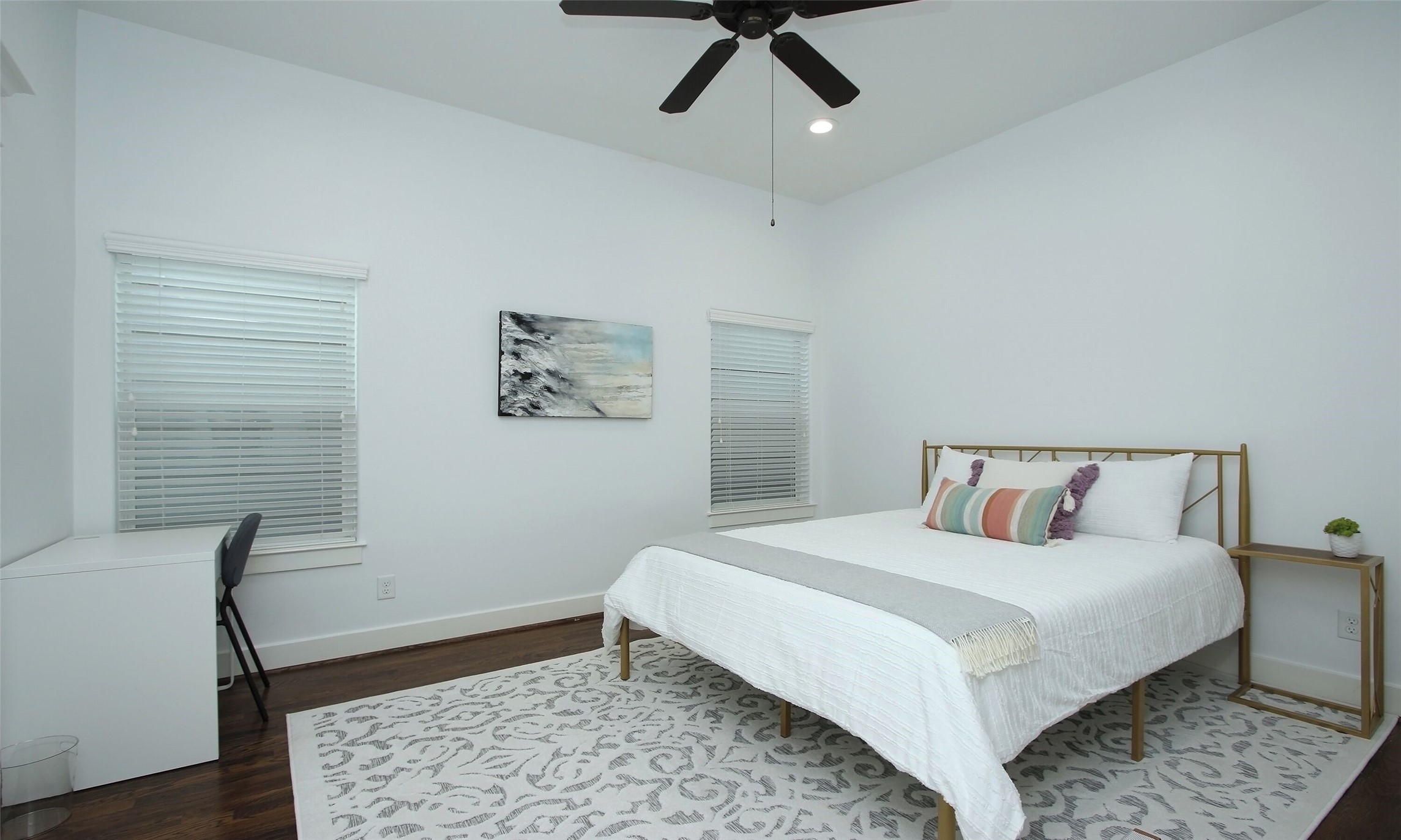 1330 West 25th Street, Unit C Houston, TX 77008 - Photo 24 of 30 a bedroom with a bed and a chair