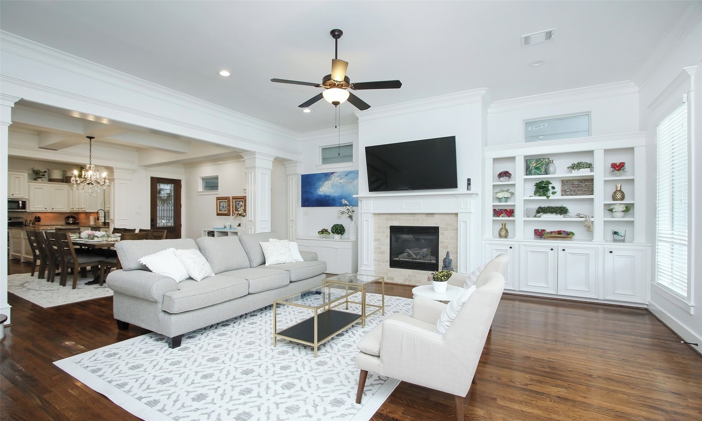 1330 West 25th Street, Unit C Houston, TX 77008 - Photo 27 of 30 a living room with furniture a fireplace and a flat screen tv