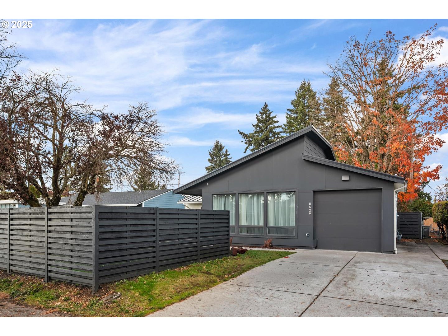 a view of a house with a yard
