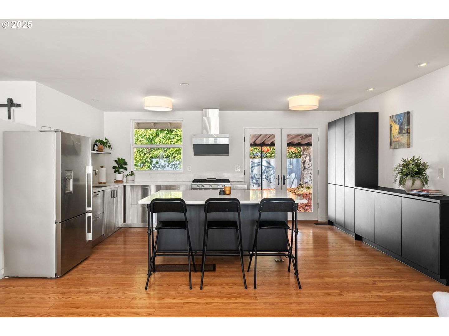 8629 Northeast Clackamas Street Portland, OR 97220 - Photo 13 of 32 a view of a dining room with furniture and a wooden floor