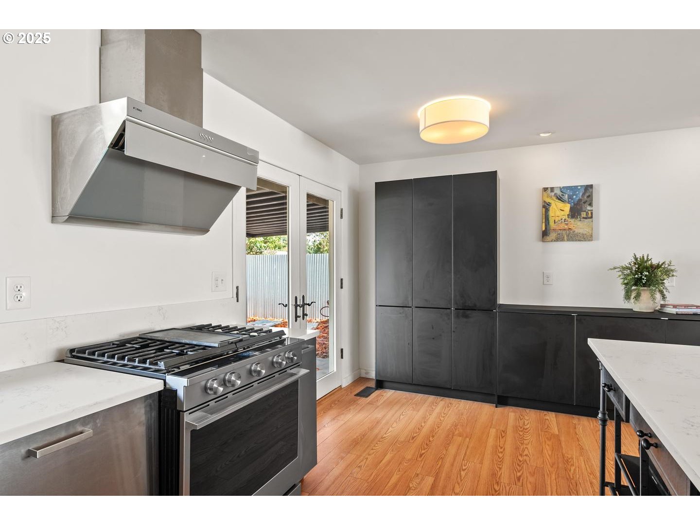 8629 Northeast Clackamas Street Portland, OR 97220 - Photo 17 of 32 a kitchen with a stove and a refrigerator