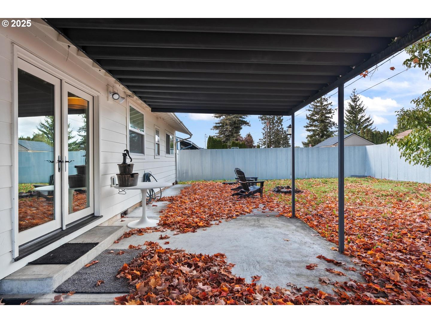 8629 Northeast Clackamas Street Portland, OR 97220 - Photo 25 of 32 a backyard of a house with table and chairs