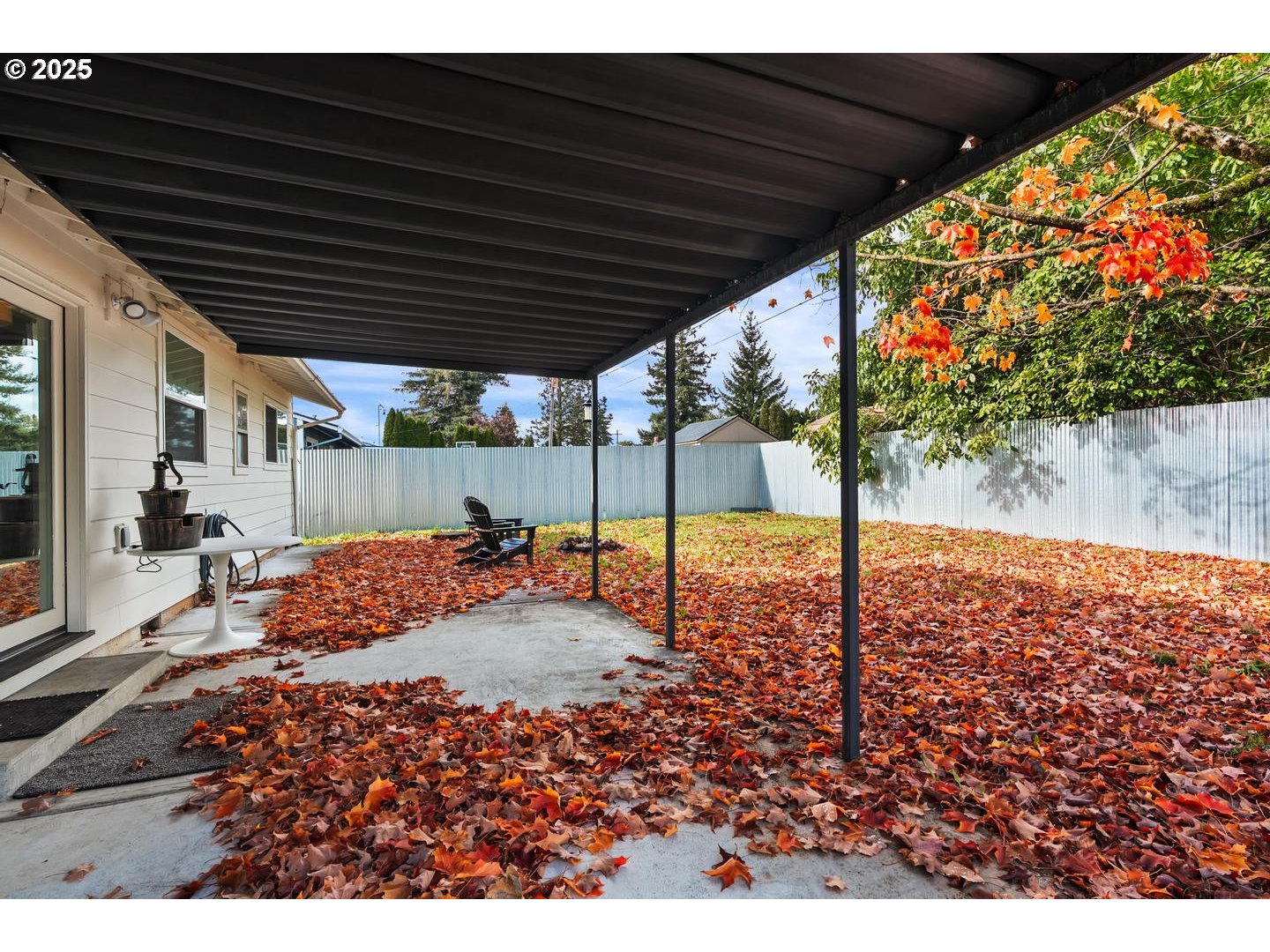 8629 Northeast Clackamas Street Portland, OR 97220 - Photo 27 of 32 a backyard of a house with table and chairs