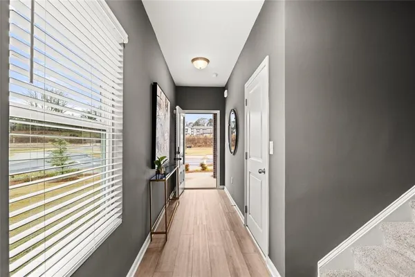 a kitchen with stainless steel appliances granite countertop a stove a refrigerator and a microwave