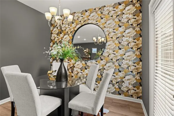 a living room with lots of furniture and kitchen view