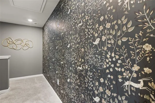 a spacious en suite bathroom with a double vanity sink and a mirror