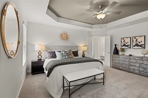 a living room with furniture and a lamp