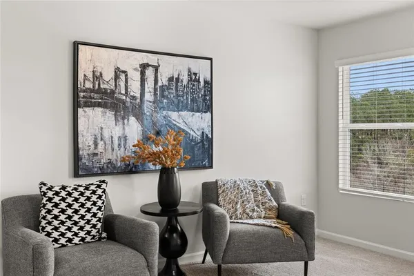 a bedroom with a bed and a lamp