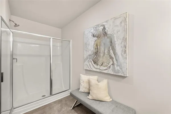 a bathroom with a toilet a sink a mirror a bathtub and vanity