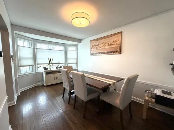 a view of a dining room with furniture and window