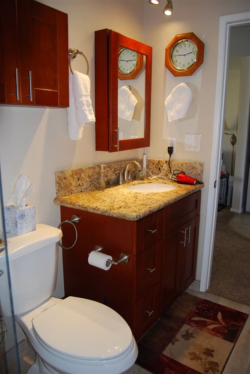 2747 South Kihei Road, Unit A201 Kihei, HI 96753 - Photo 11 of 29 a bathroom with a granite countertop toilet sink and mirror