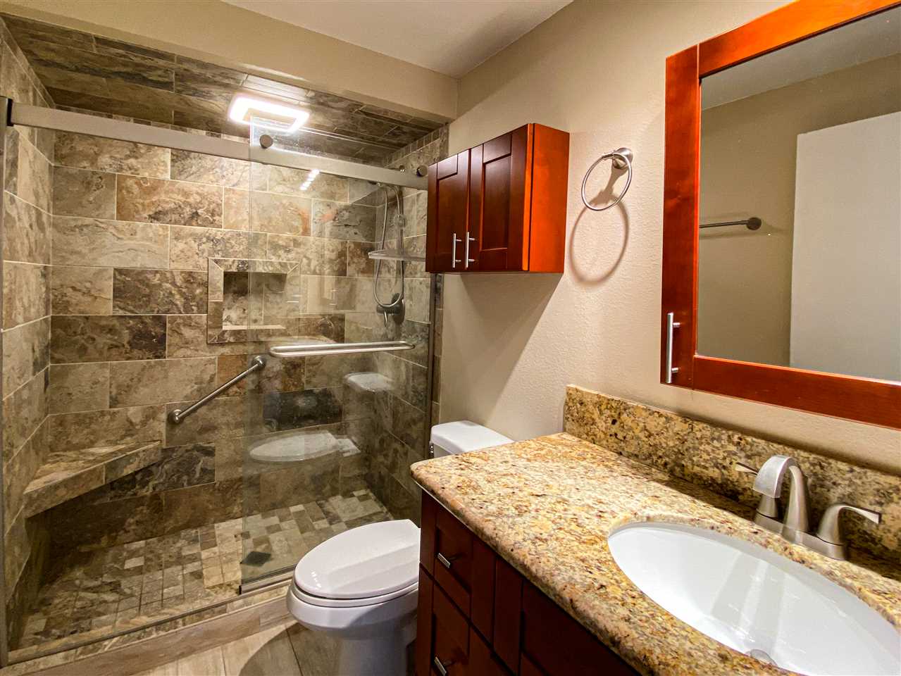 2747 South Kihei Road, Unit A201 Kihei, HI 96753 - Photo 12 of 29 a bathroom with a granite countertop sink toilet and shower