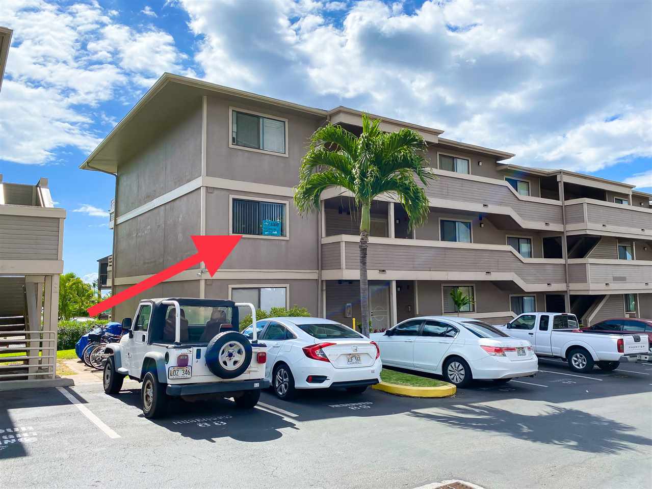 2747 South Kihei Road, Unit A201 Kihei, HI 96753 - Photo 2 of 29 a front view of a building with parking space