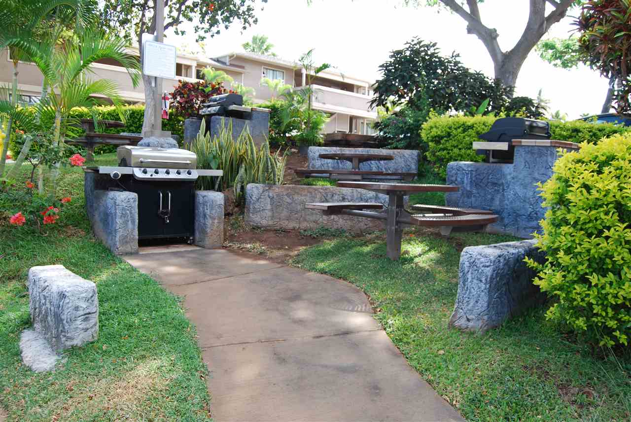 2747 South Kihei Road, Unit A201 Kihei, HI 96753 - Photo 27 of 29 a view of a garden with plants and large trees