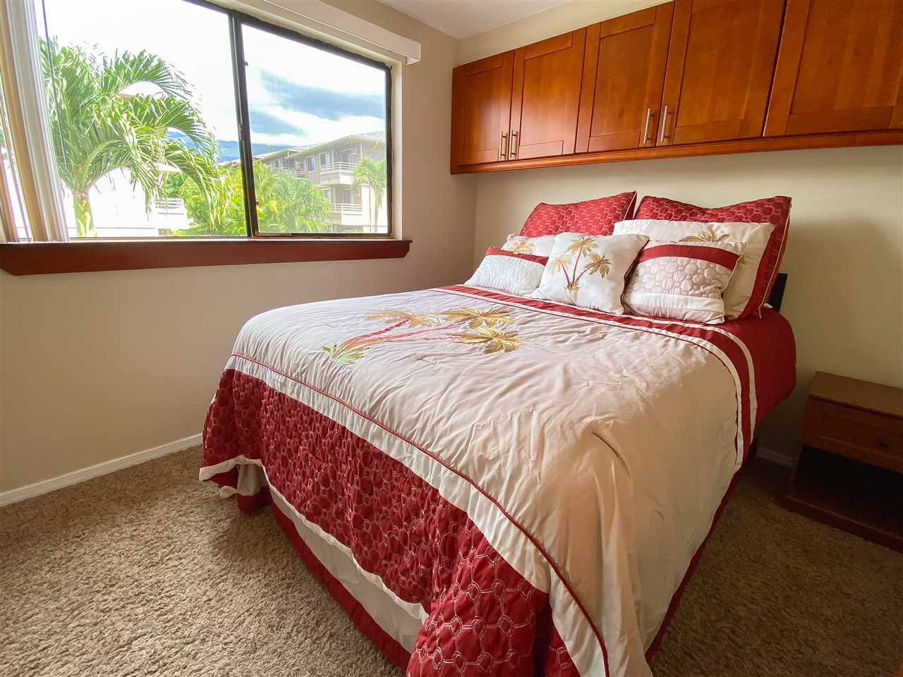 2747 South Kihei Road, Unit A201 Kihei, HI 96753 - Photo 8 of 29 a bed sitting in a bedroom next to a window