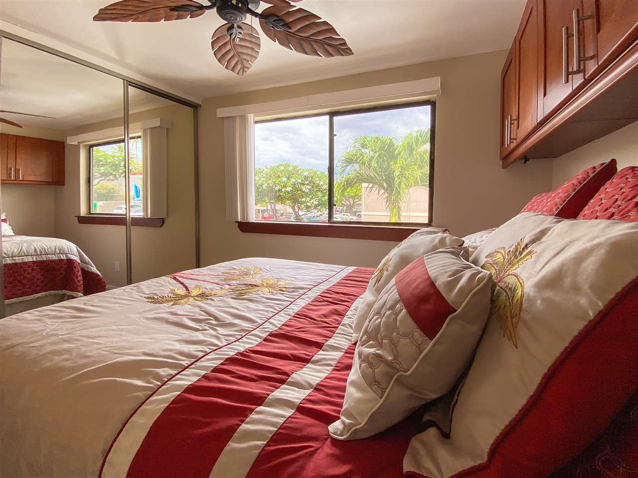 2747 South Kihei Road, Unit A201 Kihei, HI 96753 - Photo 10 of 29 a bed sitting in a bedroom next to a window