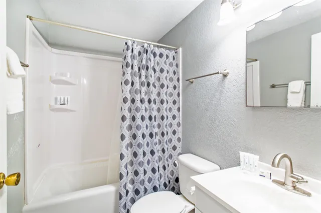 a bathroom with a sink toilet and a bathtub
