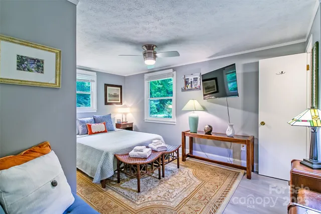 a bedroom with furniture and a window