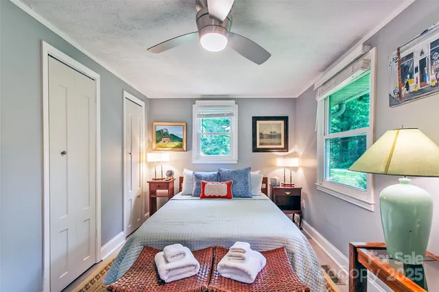 a bedroom with furniture and a window