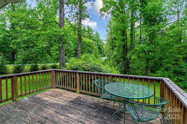 a view of a balcony with wooden floor