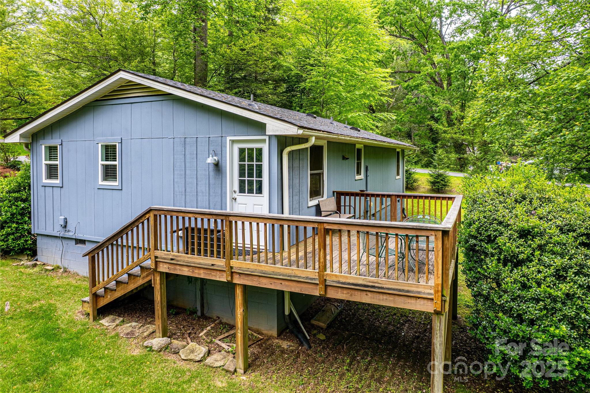 15 Pope Road Brevard, NC 28712 - Photo 24 of 29 a view of a house with a wooden deck and furniture