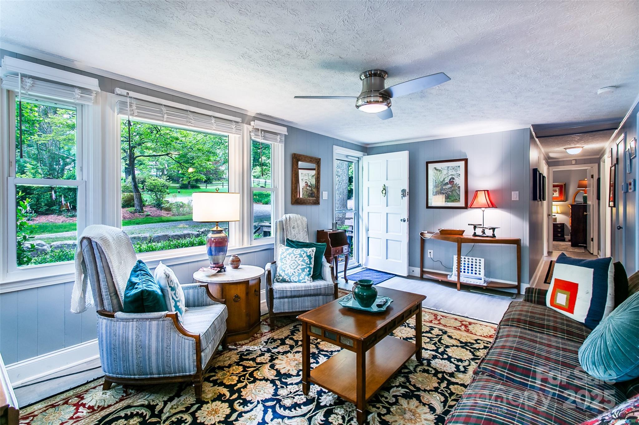 15 Pope Road Brevard, NC 28712 - Photo 6 of 29 a living room with patio furniture and a floor to ceiling window