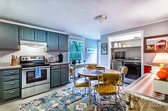 a kitchen with a stove a sink and a refrigerator