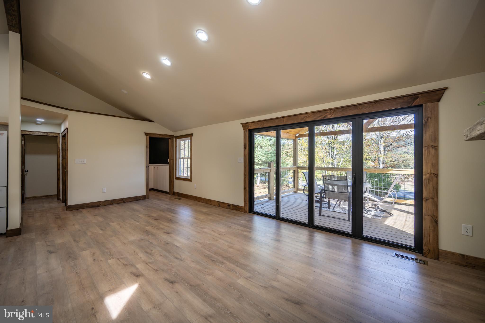 3456 Glendale Road Swanton, MD 21561 - Photo 23 of 93 an empty room with wooden floor and door