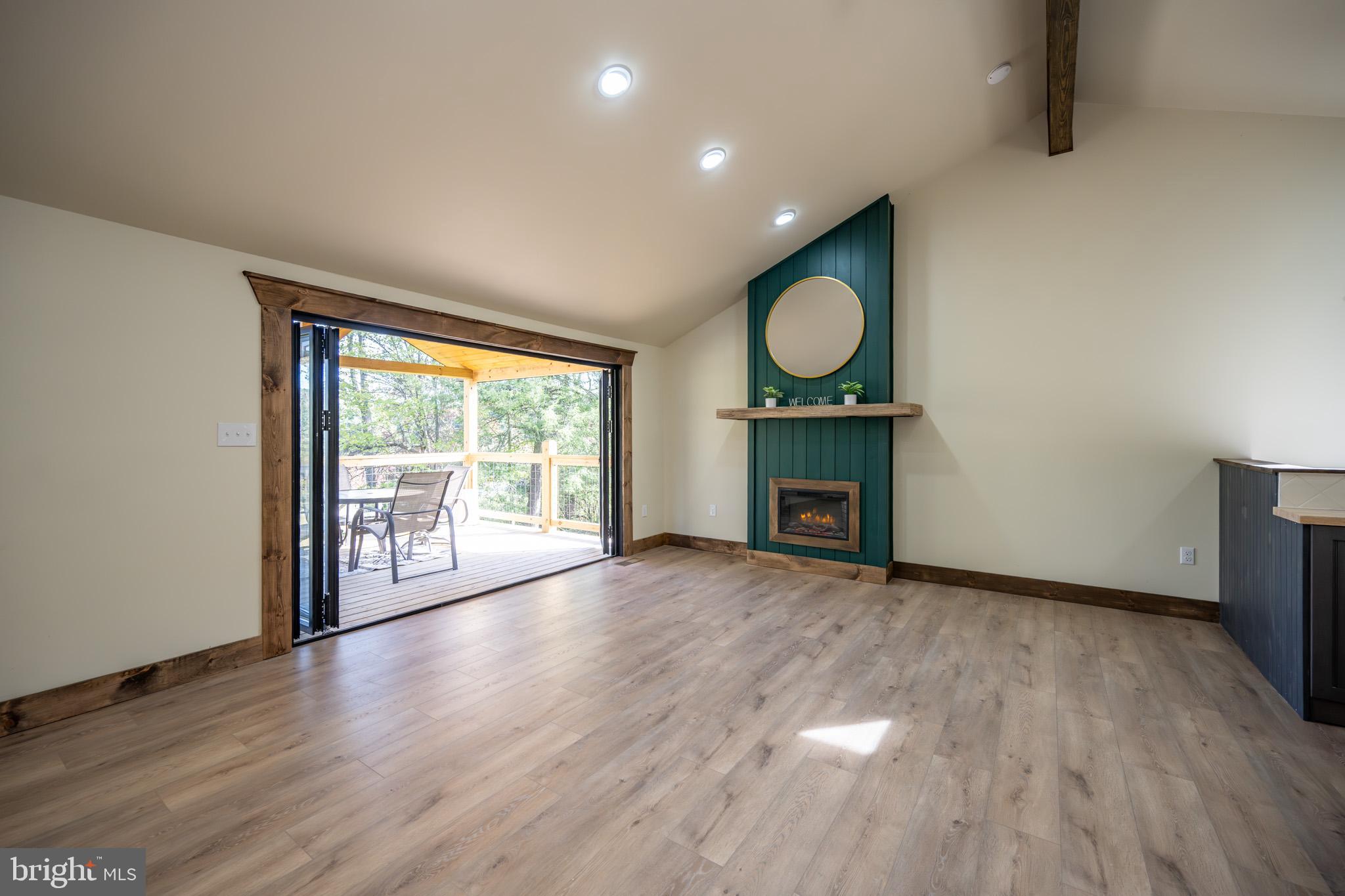 3456 Glendale Road Swanton, MD 21561 - Photo 25 of 93 a view of an empty room with wooden floor and a window