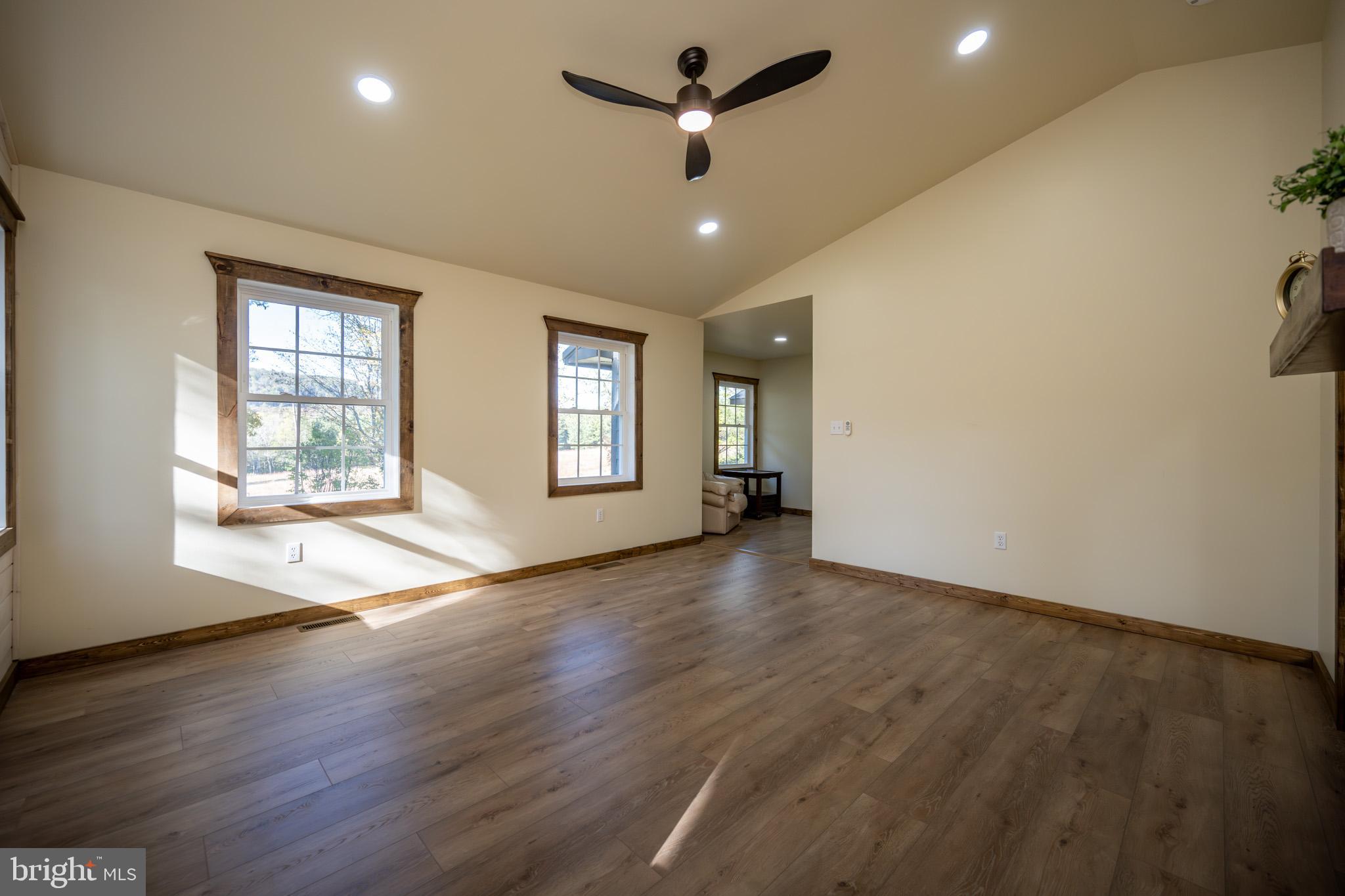 3456 Glendale Road Swanton, MD 21561 - Photo 42 of 93 a view of an empty room with a window and wooden floor