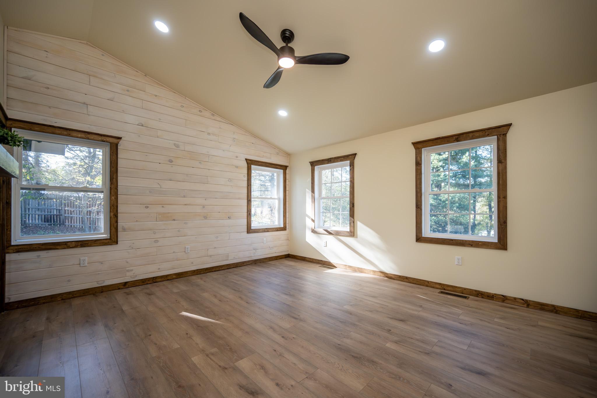 3456 Glendale Road Swanton, MD 21561 - Photo 44 of 93 a view of an empty room with wooden floor and a window