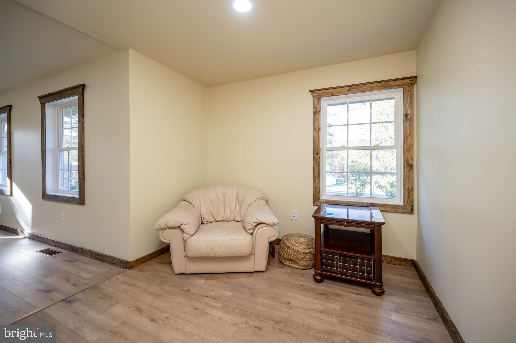 3456 Glendale Road Swanton, MD 21561 - Photo 46 of 93 a living room with furniture a wooden floor and a window