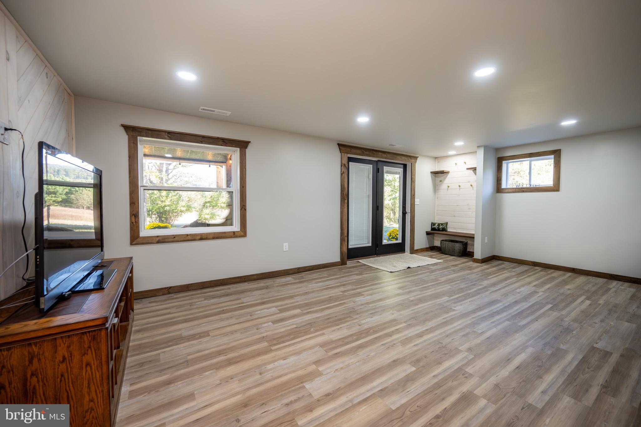 3456 Glendale Road Swanton, MD 21561 - Photo 66 of 93 a view of a livingroom with wooden floor and a window