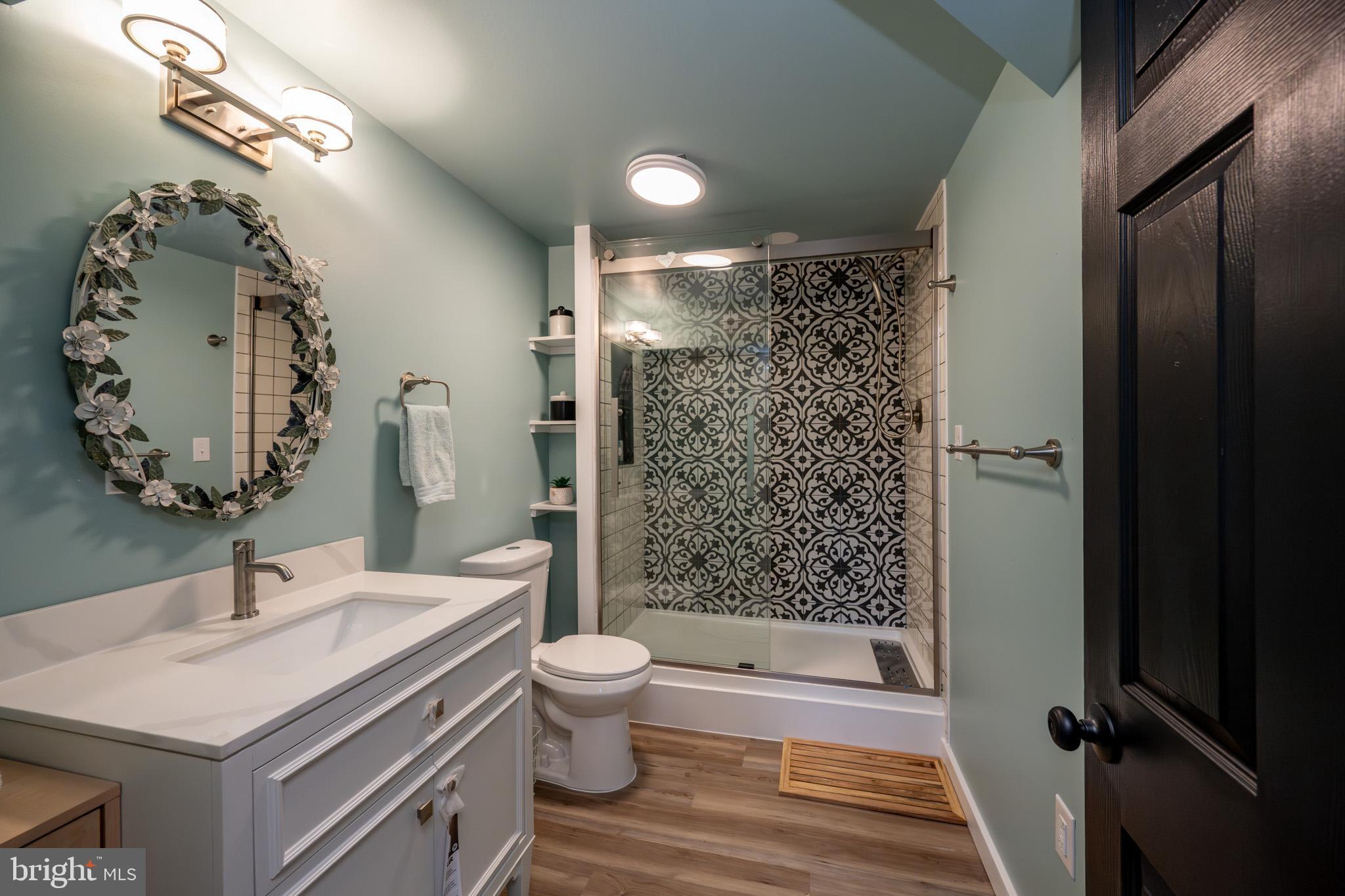 3456 Glendale Road Swanton, MD 21561 - Photo 78 of 93 a bathroom with a sink toilet and shower