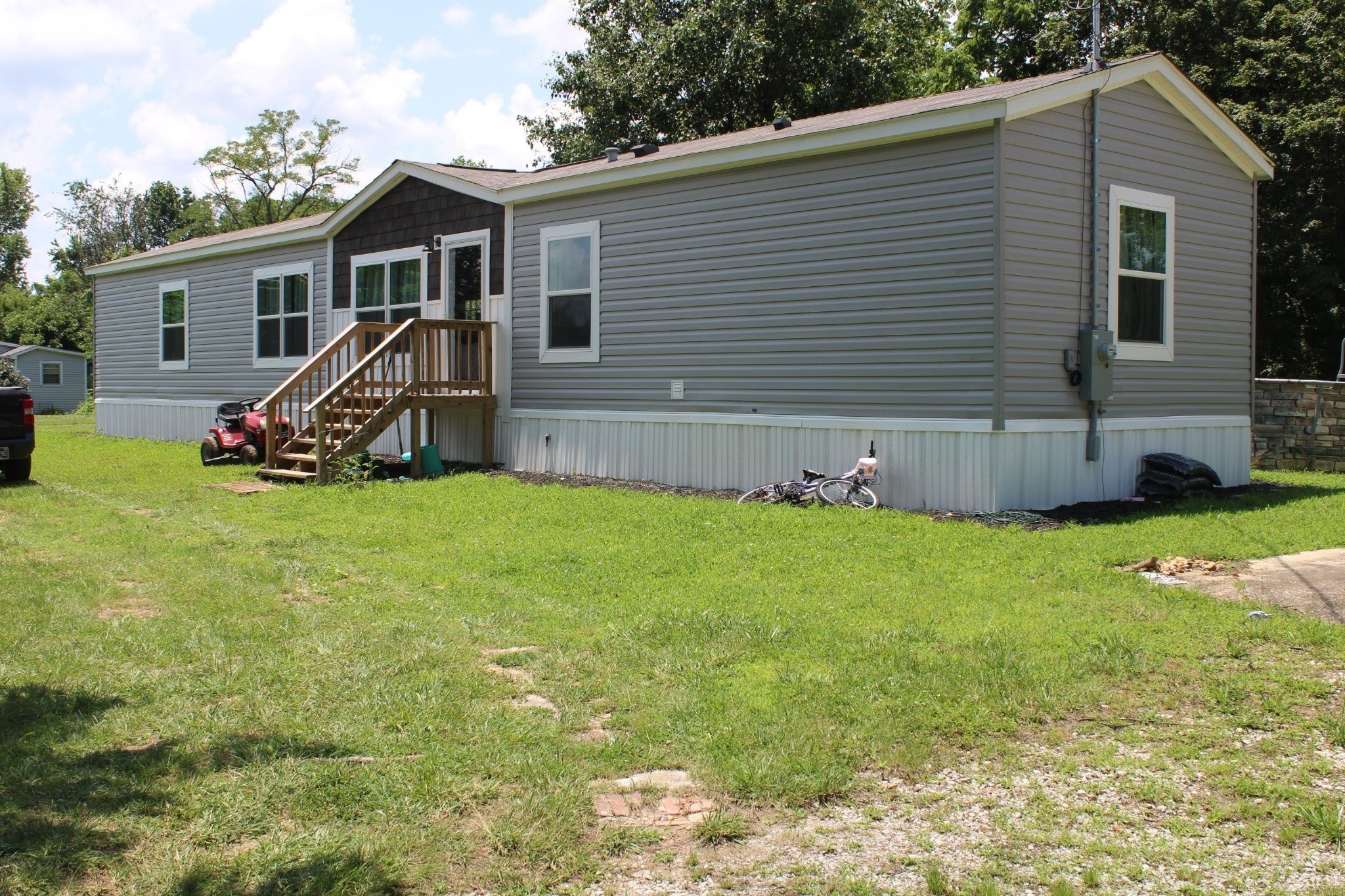 890 Oak Grove Road Goodspring, TN 38460 - Photo 18 of 18 a view of a house with a yard and sitting area