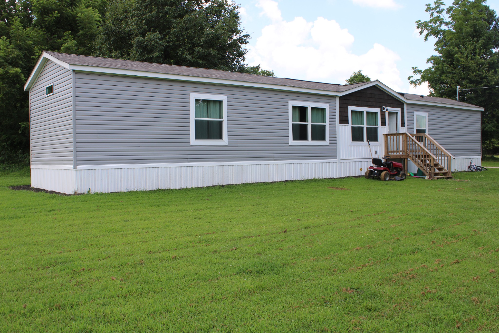 890 Oak Grove Road Goodspring, TN 38460 - Photo 2 of 18 a view of a house with a yard and sitting area