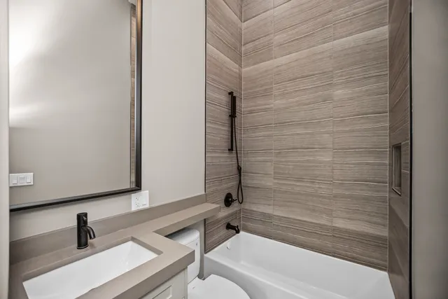 a bathroom with a bathtub and a sink