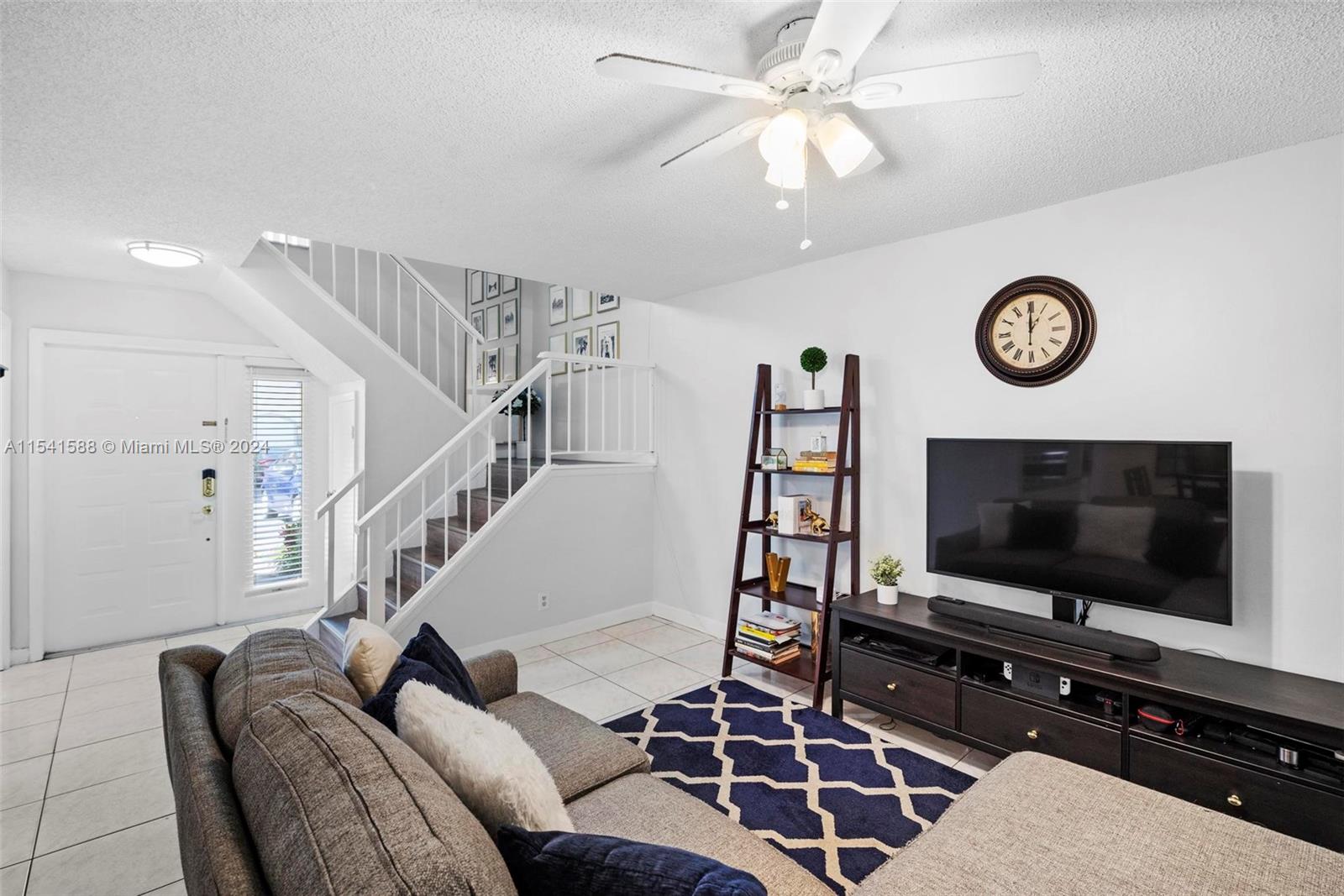 7200 Northwest 2nd Avenue, Unit 1250 Boca Raton, FL 33487 - Photo 13 of 57 a living room with furniture and a flat screen tv