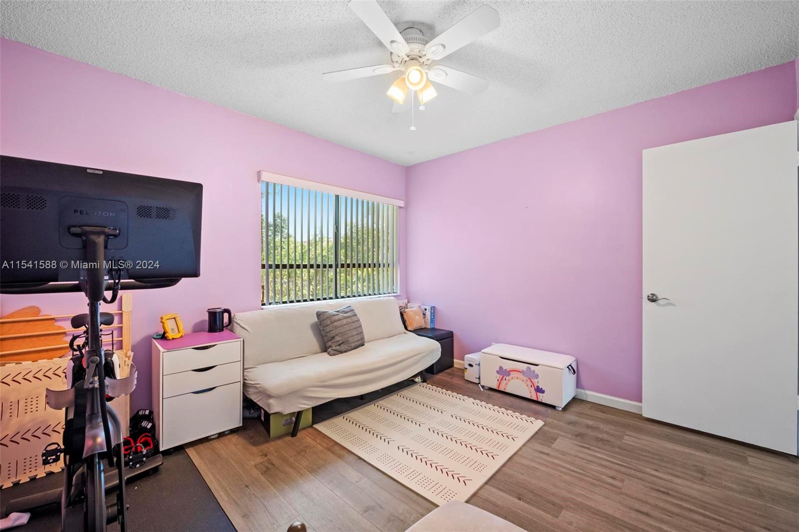 7200 Northwest 2nd Avenue, Unit 1250 Boca Raton, FL 33487 - Photo 26 of 57 a living room with furniture and a flat screen tv