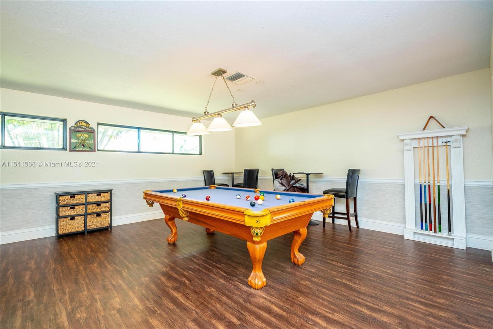 7200 Northwest 2nd Avenue, Unit 1250 Boca Raton, FL 33487 - Photo 42 of 57 a room with wooden floor pool table and windows